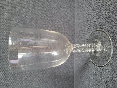 Antique crystal wine glass with a twisted stem.